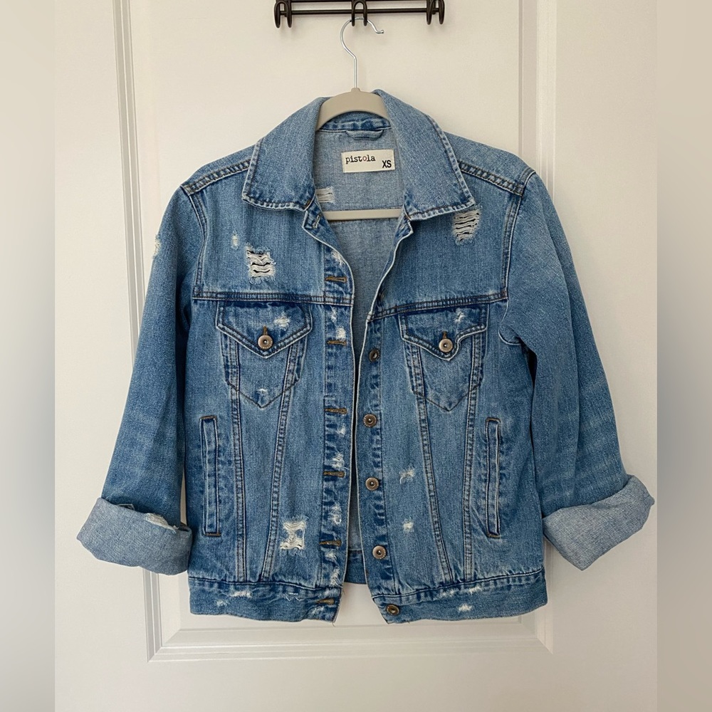 Ripped denim jacket with pockets